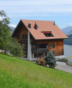 a house with a roof on top of a hill at Hidden paradise homestay in Rongli