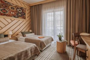 เตียงในห้องที่ Hotel Jaworzyna Krynicka