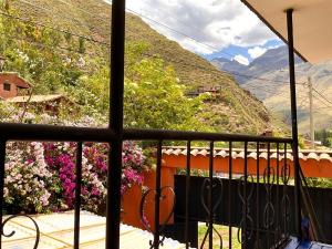 a view from a balcony with a view of mountains at Authentic Peruvian home with gorgeous patio in Pisac