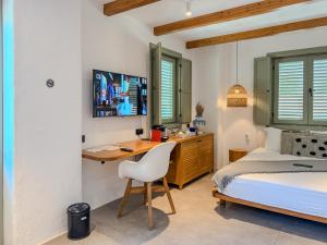 a bedroom with a bed and a desk with a computer at Carpe Diem Boutique Hotel - Adults Only in Side