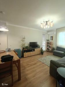 a living room with a couch and a table at Tbilisi Dirsi Complex in Tbilisi City