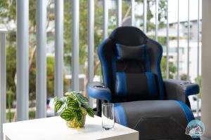 a desk with a chair and a glass on a table at Epping 2BR House with Parking in Epping