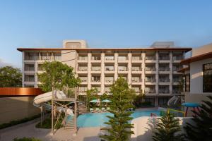 a view of a hotel with a swimming pool at Marni Pattaya in Pattaya South