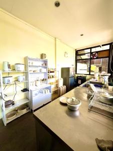 a large kitchen with a counter and a refrigerator at Isla Boracay Inn in Boracay