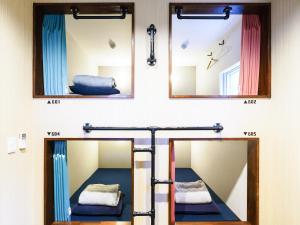 a room with a mirror and a bunk bed at 柏島ヴィレッジ Kashiwajima Village in Otsuki +147 photos