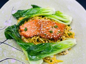 a plate of pasta with meat and vegetables on it at Ostro Hotel in Phnom Penh +27 photos