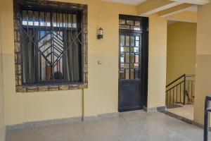 a pair of doors on the side of a building at Appart Naxel in Kinshasa