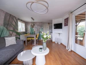 a living room with a couch and a table at Ermrest Cottage in Erm