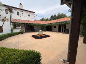 a courtyard with a fountain in the middle of a building at El Grouso in Blenheim +8 photos