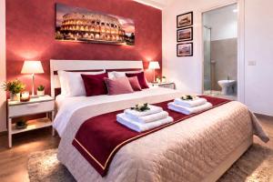 a bedroom with a large bed with towels on it at Italo House in Opera