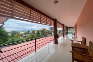 a balcony with a view of the city at P&P Place in Kanchanaburi City