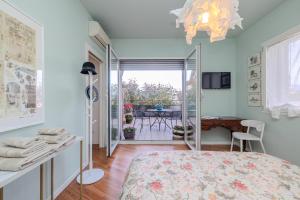 a bedroom with a bed and a dining room at Charme a Bergamo in Bergamo