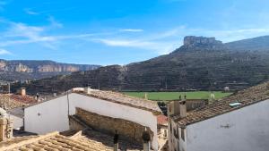 a view of the mountains from the roofs of houses at Casa Mola in Forcall