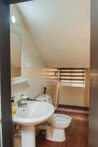 a bathroom with a sink and a toilet at The Lekki Retreat in Lekki +64 photos