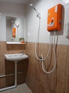 a bathroom with a shower and a sink at บ้านในสวนรีสอร์ทBannnaisuan Resort in Prachuap Khiri Khan +33 photos