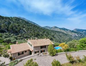 an aerial view of a house with a swimming pool at Villa Es Barracar Caimari in Caimari