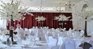 a banquet room with white tables and white chairs at Burlington Hotel, BW Premier Collection by Best Western in Folkestone