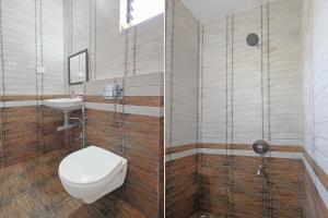 a bathroom with a toilet and a sink at FabHotel Crystal Bay Baga in Baga +20 photos
