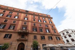 a large brick building with a lot of windows at Lary's - San Pietro in Rome
