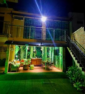 a house with a patio at night with a light at Premium Residence in Maputo