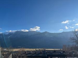 a view of a mountain range with mountains in the background at Apartment Luna in Bovec
