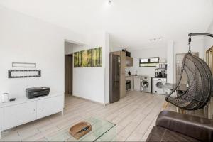 a living room with a couch at Soho Junction fourways in Sandton