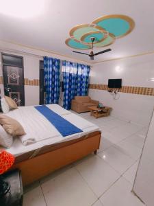 a bedroom with a bed and a living room at S D palace in Dighori +7 photos
