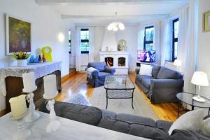 a living room with a couch and a fireplace at Holiday home, oasis of peace, Polanow in Pollnow