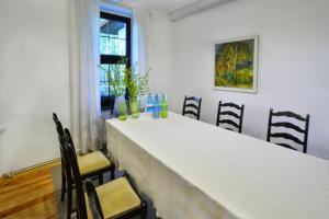 a white counter in a room with chairs at Holiday home, oasis of peace, Polanow in Pollnow