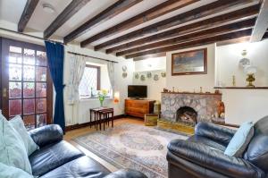a living room with a couch and a fireplace at 2 Bed in Porthcawl oc-way245 in Porthcawl
