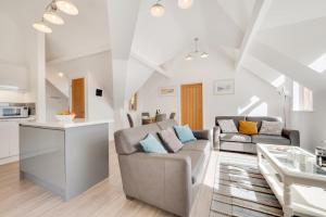a living room with a couch and a table at 2 Bed in Aberdyfi oc-wah694 in Aberdyfi