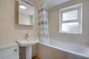 a white bathroom with a sink and a window at 2 Bed in Langland oc-hh193 in Newton +10 photos