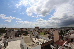 a view of a city from the roof of a building at Hotel Ganges Park in Haridwār