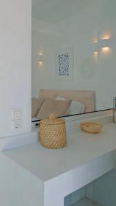 a basket sitting on a counter in a kitchen at Seapalm Villa - Elegant Stay - Steps from the Sea in Lachania