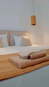 a bedroom with a bed with a blanket on it at Seapalm Villa - Elegant Stay - Steps from the Sea in Lachania +62 photos