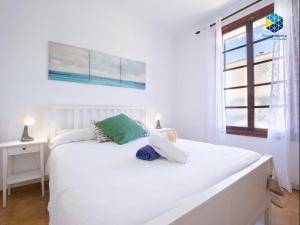 a white bed in a room with a window at Ca sa comare in Llucmajor +72 photos