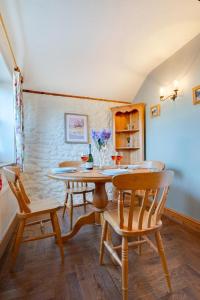 a dining room with a table and chairs at 2 Bed in Heacham oc-2365 in Heacham