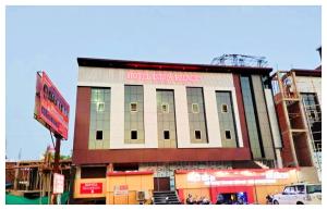 a building with a sign on the side of it at Hotel Indra Palace Jaunpur in Jaunpur