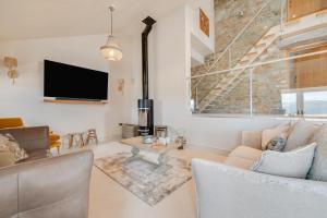 a living room with a couch and a tv at 3 Bed in Trawsfynydd oc-wag718 in Trawsfynydd
