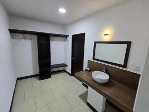 a bathroom with a sink and a mirror at Hotel Villa Capricho in Ciudad Madero +63 photos