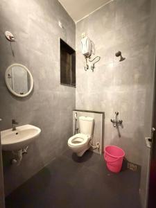 a bathroom with a toilet and a sink at Moonstone Royal Resort in Jāmb +18 photos