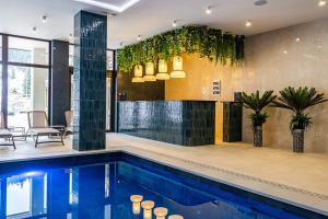 a swimming pool in a room with a house at Continental SPA in Bukovel