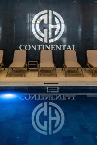 a group of chairs sitting next to a swimming pool at Continental SPA in Bukovel