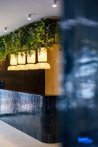 a row of lights on a wall with plants at Continental SPA in Bukovel