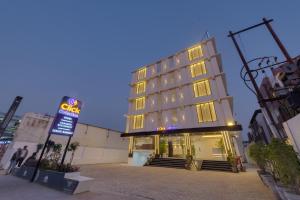 a hotel building with a sign in front of it at Click Collection Ayodhya in Ayodhya
