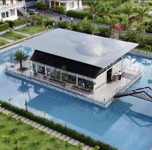 an overhead view of a house with a swimming pool at Advaya Luxury Resort, Sakleshpur in Sakleshpur