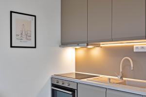 a kitchen with a sink and a counter top at Moskovska with Public Parking in Banská Bystrica +1 photo