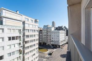 an aerial view of a city with buildings at Luxurious apartment next to the sea and city centre with free parking space in Ostend