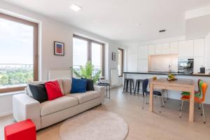 a living room with a couch and a table at Perfectly situated condo with amazing views in Ostend