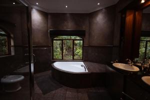 a large bathroom with a tub and two sinks at Natures View in Pretoria +98 photos